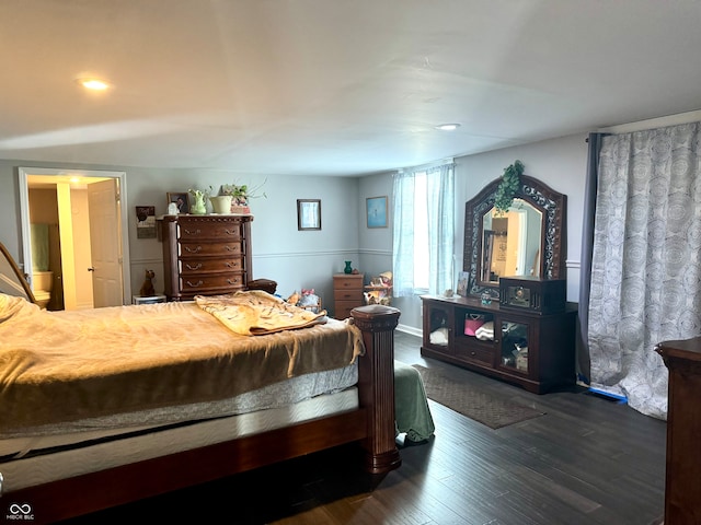 bedroom featuring dark hardwood / wood-style floors