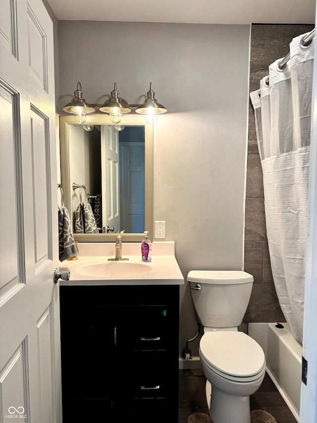 full bathroom with shower / bathtub combination with curtain, toilet, vanity, and hardwood / wood-style flooring