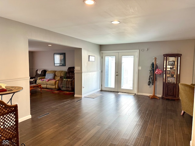 foyer with french doors and dark wood-type flooring