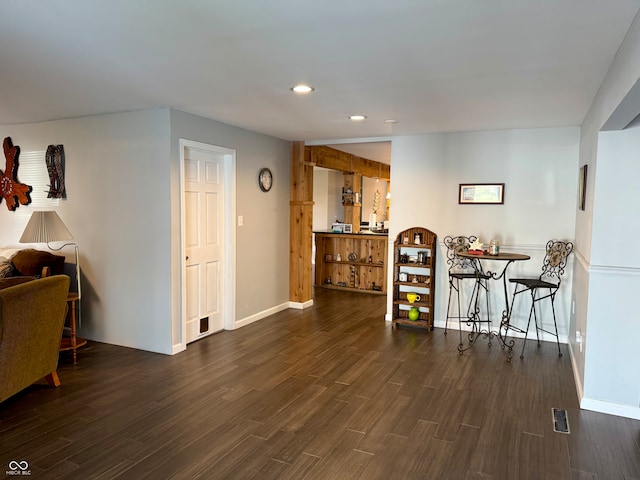 dining space with dark wood-type flooring