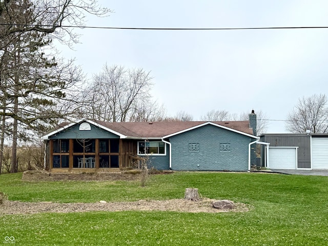 view of front of home featuring a sunroom and a front yard