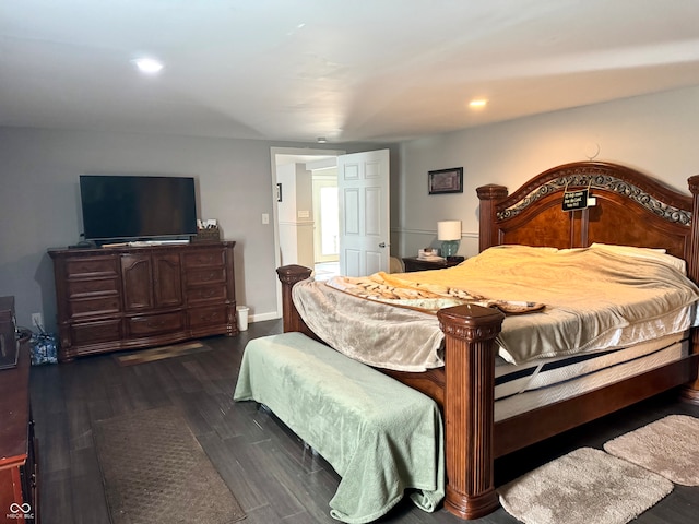 bedroom with dark hardwood / wood-style flooring