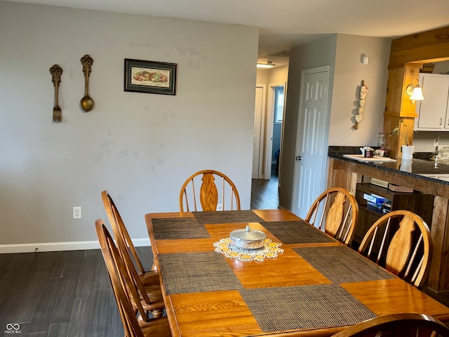 dining room featuring dark hardwood / wood-style flooring