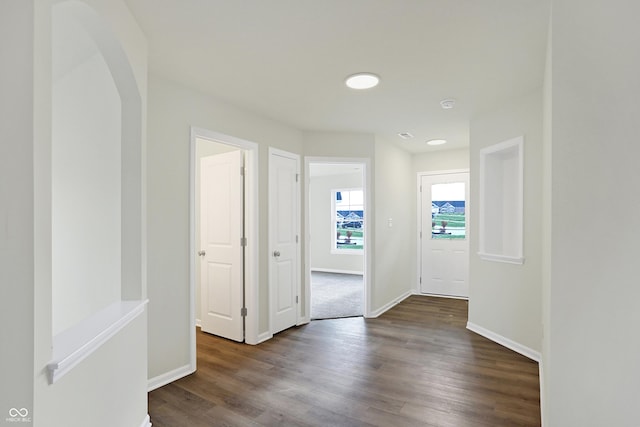 hallway with dark wood-type flooring