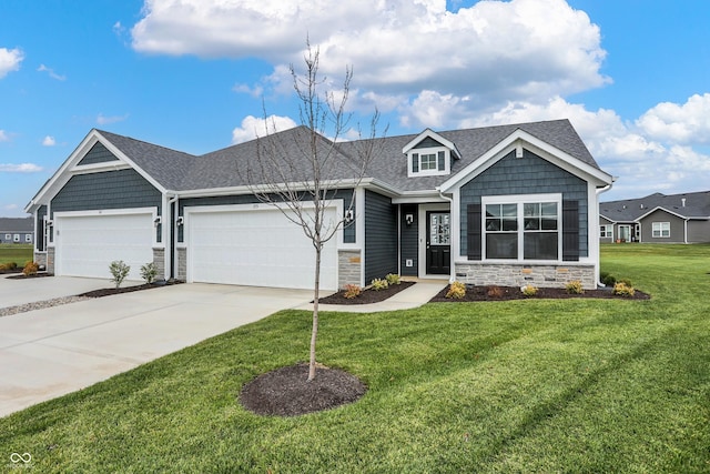 craftsman-style house with a garage and a front lawn