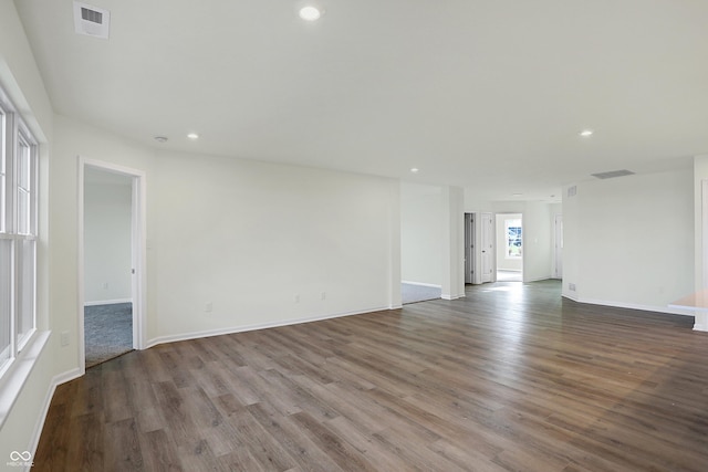 unfurnished room with hardwood / wood-style flooring