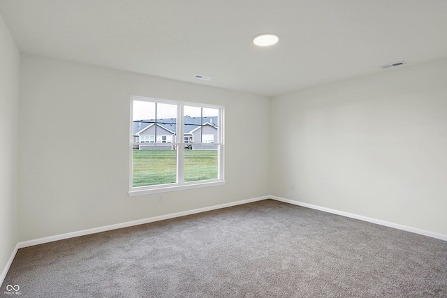 unfurnished room with carpet flooring