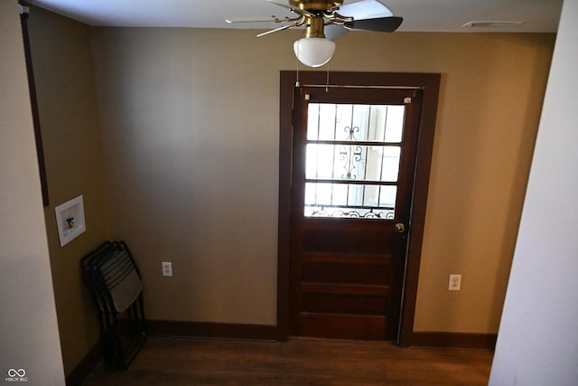 doorway to outside featuring ceiling fan and dark hardwood / wood-style flooring