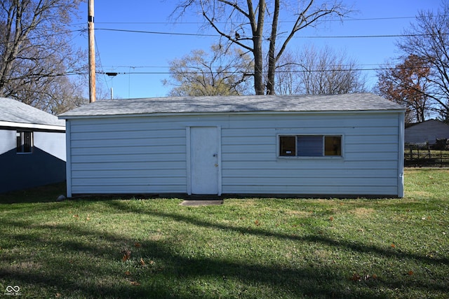 view of outbuilding with a lawn