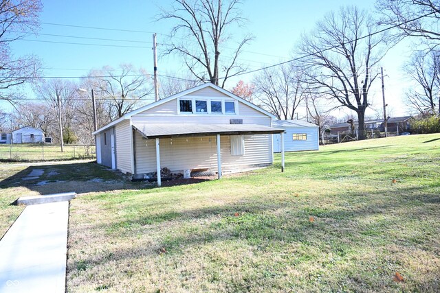 view of side of property featuring a yard