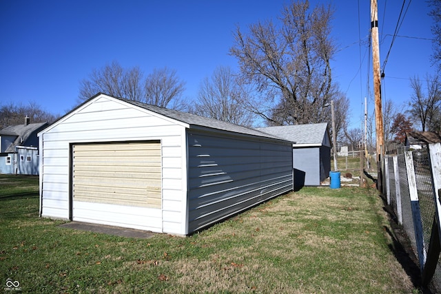 garage featuring a yard