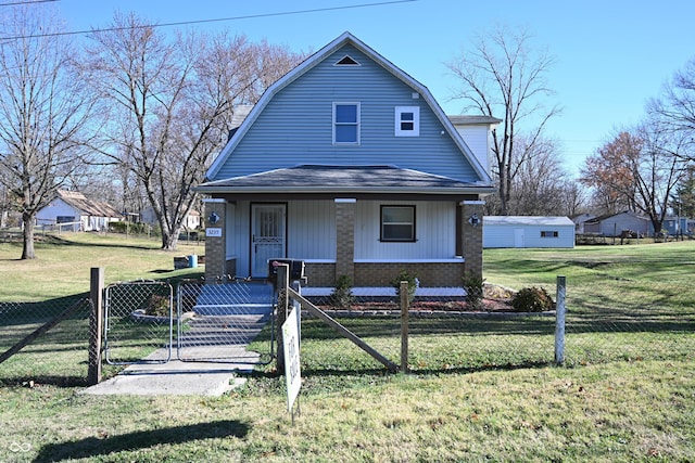 view of front of property featuring a front yard and a porch