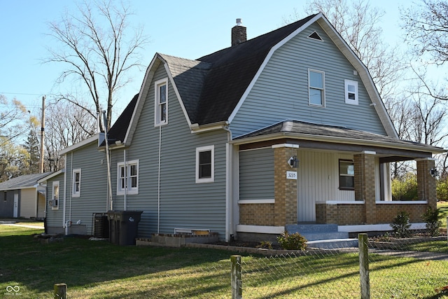 view of property exterior with a yard and a porch