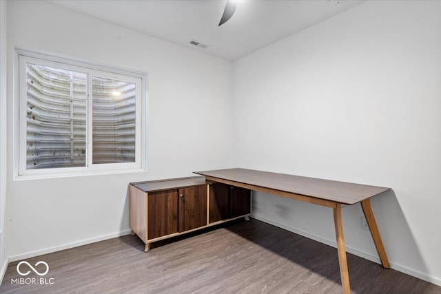 unfurnished office featuring hardwood / wood-style floors