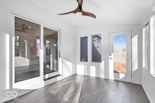 interior space with vaulted ceiling, a wealth of natural light, and ceiling fan