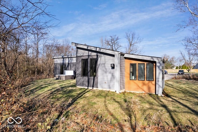 view of outbuilding with a lawn