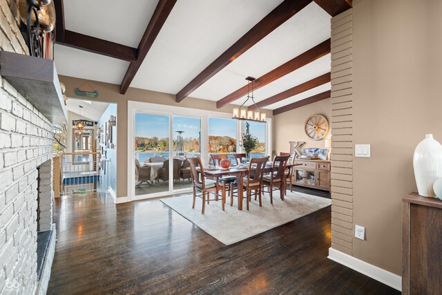 9454 Raintree Dr S, Columbus, IN 47201 - dining space featuring wood finished floors, a chandelier, and baseboards