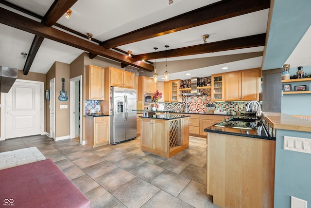 kitchen featuring beamed ceiling, a center island, wall chimney range hood, and appliances with stainless steel finishes