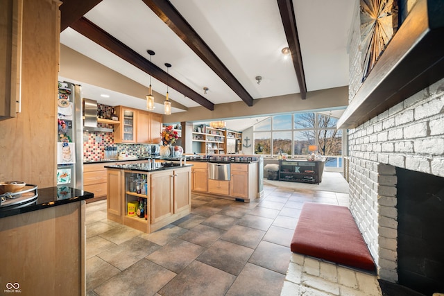 kitchen featuring a center island, light brown cabinets, lofted ceiling with beams, pendant lighting, and decorative backsplash