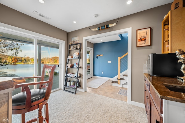 9454 Raintree Dr S, Columbus, IN 47201 - office featuring light colored carpet, recessed lighting, baseboards, and light tile patterned flooring