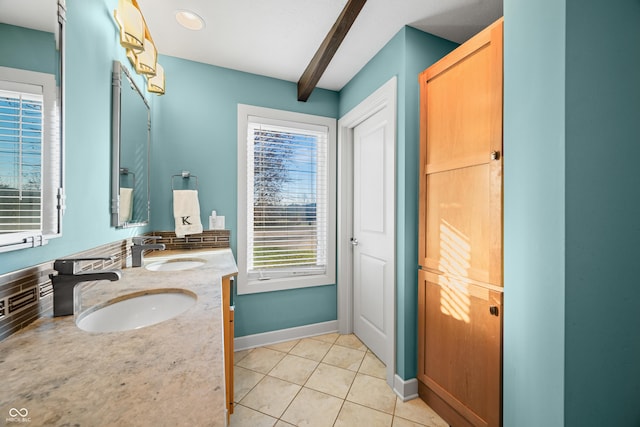 bathroom featuring beam ceiling, backsplash, tile patterned floors, and a wealth of natural light