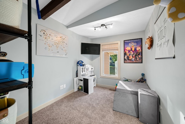 recreation room with carpet flooring and vaulted ceiling with beams