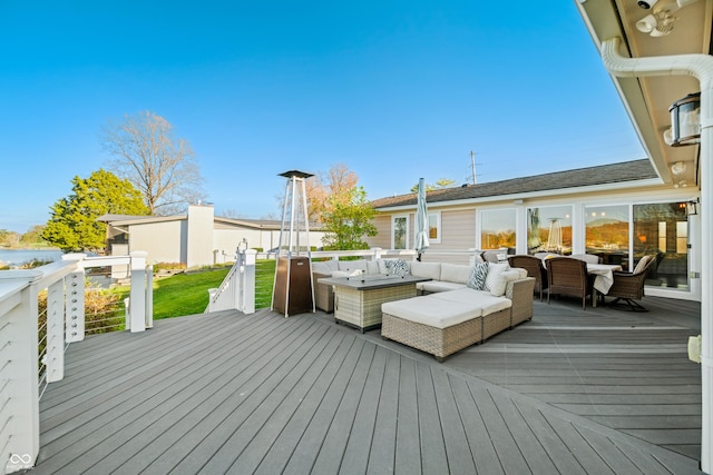 wooden terrace featuring an outdoor living space