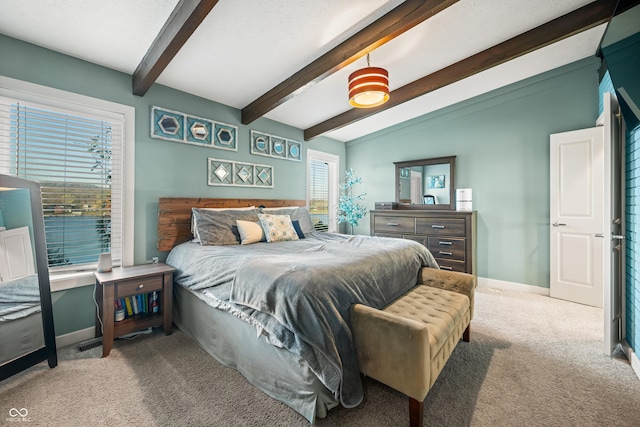 bedroom with carpet floors and lofted ceiling with beams