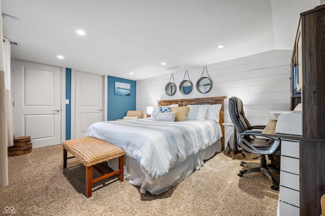 bedroom with light colored carpet and lofted ceiling