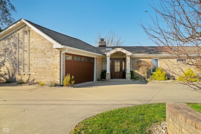 ranch-style home with a garage