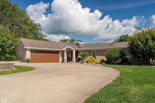9454 Raintree Dr S, Columbus, IN 47201 - ranch-style home featuring brick siding, a front lawn, a garage, concrete driveway, and a chimney