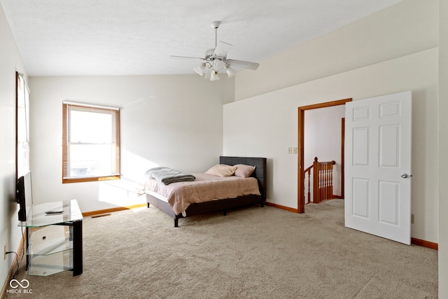 carpeted bedroom featuring ceiling fan and lofted ceiling