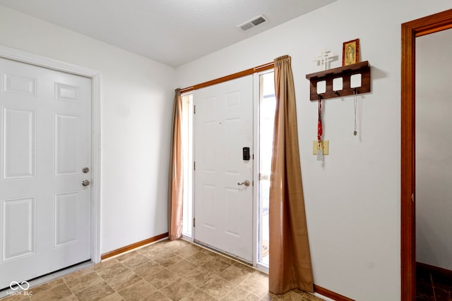 foyer featuring a textured ceiling