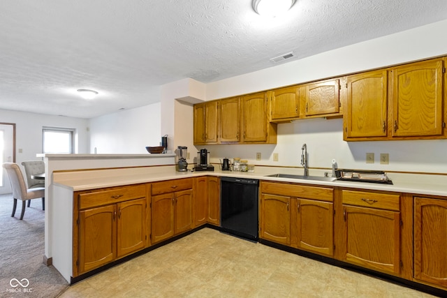 kitchen with a textured ceiling, dishwasher, kitchen peninsula, and sink