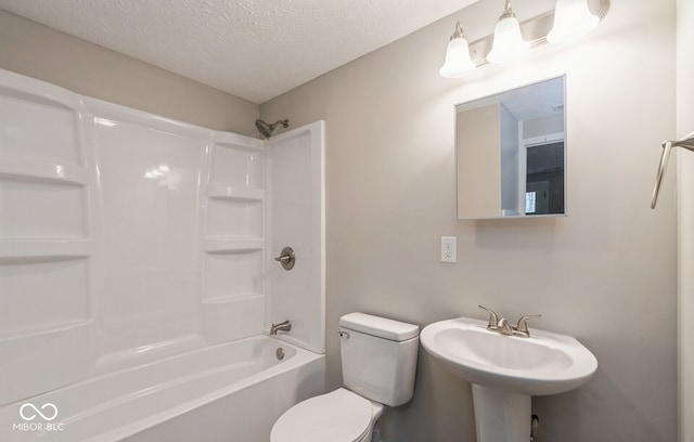 full bathroom with sink, toilet, shower / tub combination, and a textured ceiling