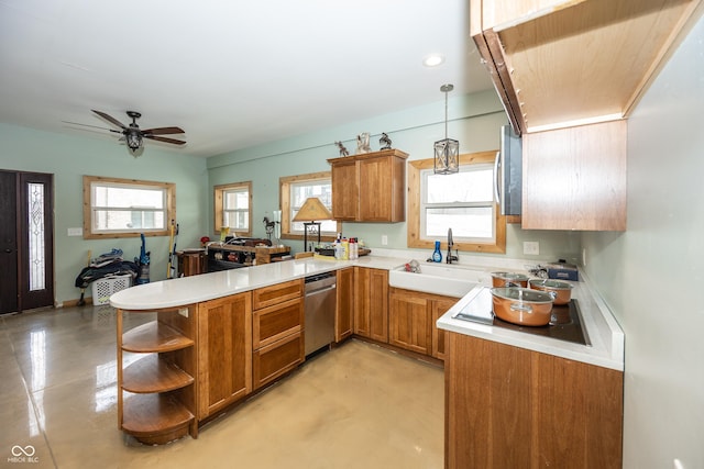 kitchen with a wealth of natural light, dishwasher, sink, kitchen peninsula, and decorative light fixtures