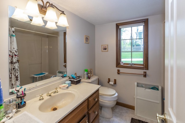 bathroom with walk in shower, vanity, a textured ceiling, and toilet