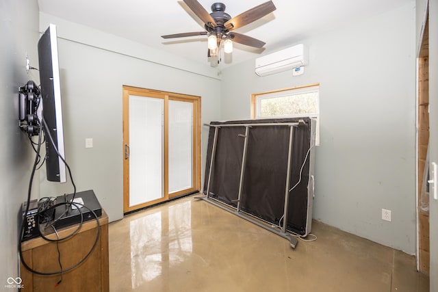 misc room with ceiling fan and a wall unit AC