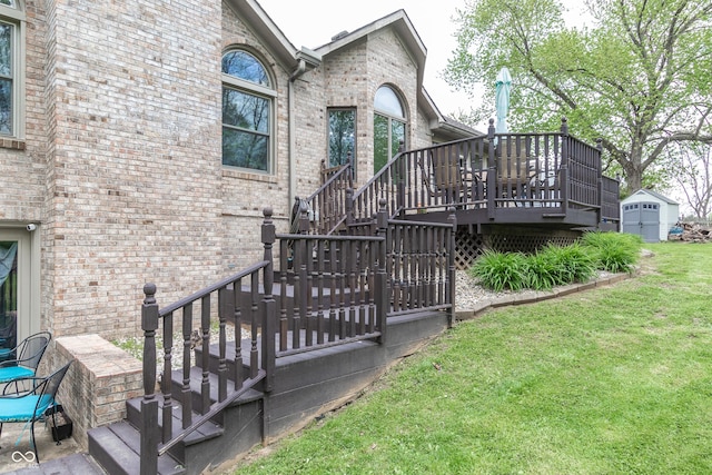 wooden terrace featuring a yard and a storage unit