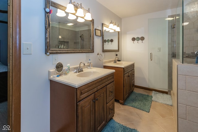 bathroom with tile patterned flooring, vanity, and an enclosed shower