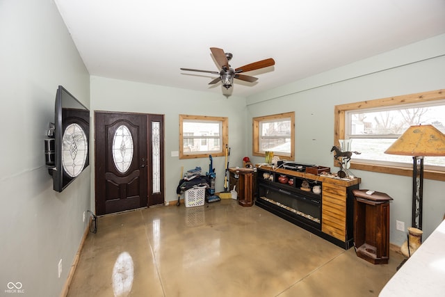 foyer entrance featuring ceiling fan