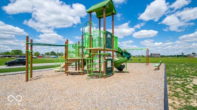 view of playground with a yard