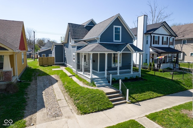 view of front of house with a porch and a front lawn