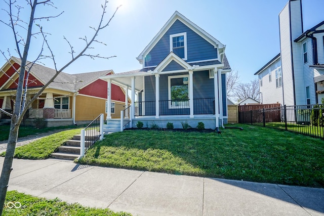 view of front of home with a porch and a front lawn