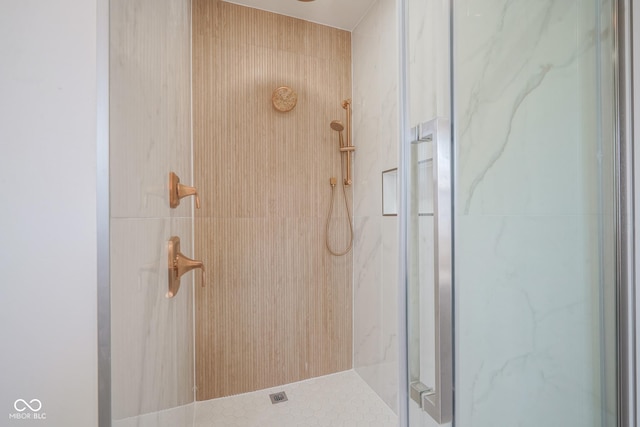 bathroom with a shower with shower door