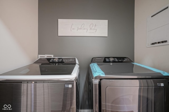 washroom with washer and clothes dryer