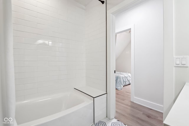 560 Jefferson Ave, Indianapolis, IN 46201 - full bath with connected bathroom, wood finished floors, and bathing tub / shower combination