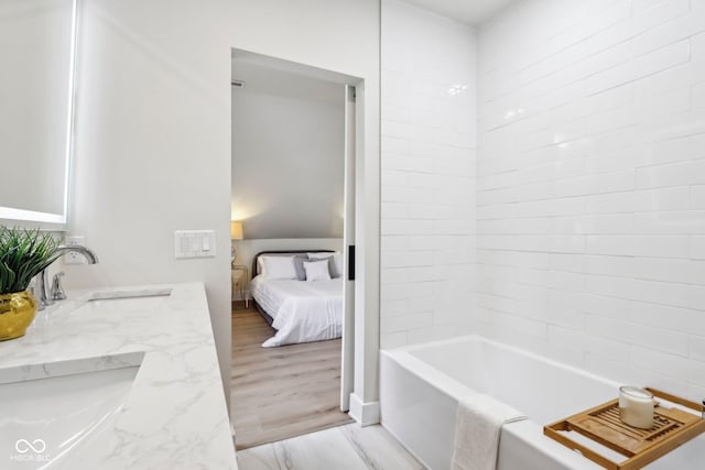 560 Jefferson Ave, Indianapolis, IN 46201 - ensuite bathroom with double vanity and tub / shower combination