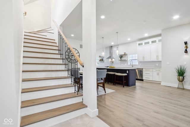560 Jefferson Ave, Indianapolis, IN 46201 - stairs with recessed lighting, wood finished floors, and baseboards