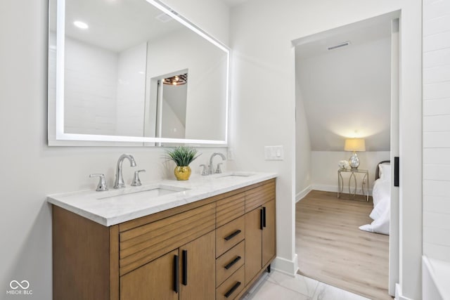560 Jefferson Ave, Indianapolis, IN 46201 - full bath featuring double vanity, baseboards, ensuite bath, and recessed lighting